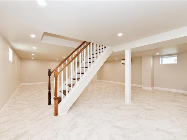 180 Evelyn Rd, Mineola, NY 11501 - basement with stairway, light marble finish floors, recessed lighting, and a wall mounted air conditioner