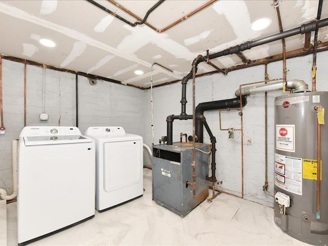 180 Evelyn Rd, Mineola, NY 11501 - laundry room featuring gas water heater, washing machine and clothes dryer, a heating unit, and marble finish floors