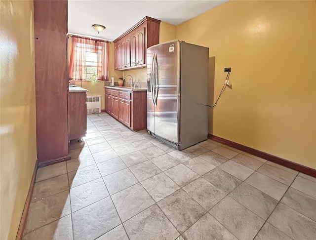 1480 Thieriot Ave Unit 5L, Bronx, NY 10460 - kitchen featuring stainless steel refrigerator with ice dispenser, radiator heating unit, light countertops, and light tile patterned floors