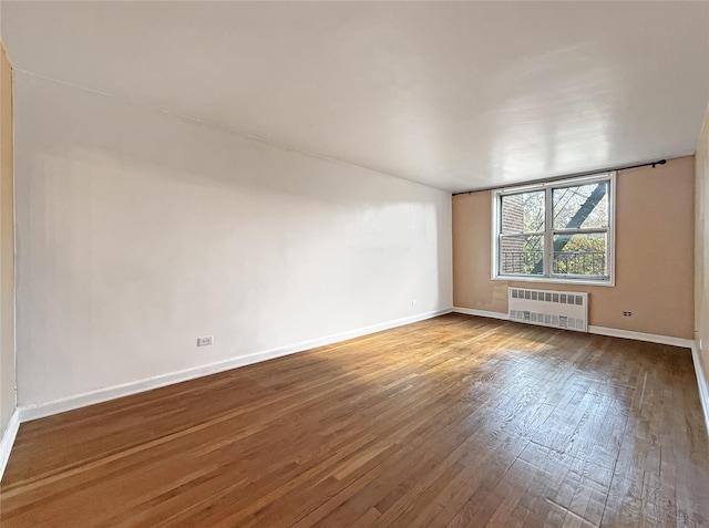 1480 Thieriot Ave Unit 5L, Bronx, NY 10460 - unfurnished room featuring radiator heating unit and hardwood / wood-style floors