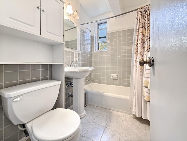 1480 Thieriot Ave Unit 5L, Bronx, NY 10460 - full bath featuring tile walls, shower / bath combo with shower curtain, and tile patterned floors