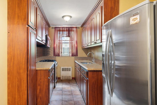 1480 Thieriot Ave Unit 5L, Bronx, NY 10460 - kitchen with appliances with stainless steel finishes, radiator, light stone countertops, and tile patterned flooring