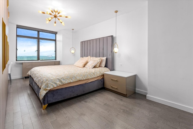 11201 Queens Blvd Unit 18D, Forest Hills, NY 11375 - bedroom featuring wood finished floors and a chandelier