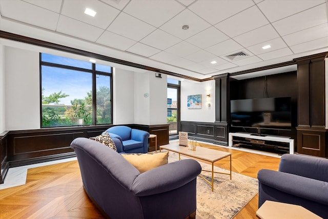 11201 Queens Blvd Unit 18D, Forest Hills, NY 11375 - living area featuring wainscoting, a drop ceiling, and ornamental molding