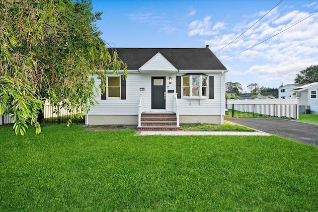 247 N Greene Ave, Lindenhurst, NY 11757 - view of front facade with asphalt driveway and a shingled roof