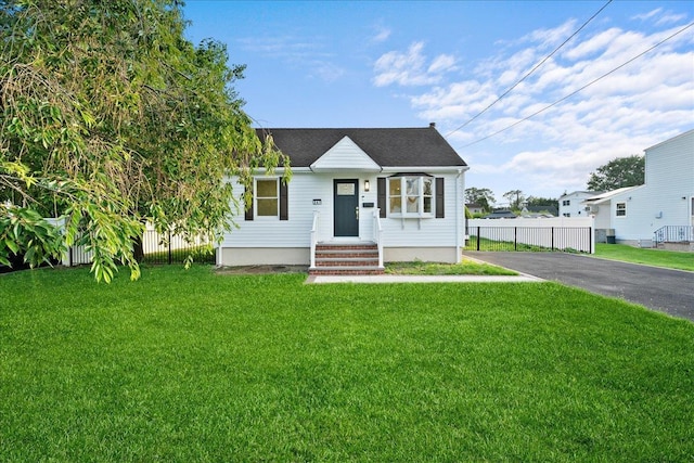 247 N Greene Ave, Lindenhurst, NY 11757 - view of front facade featuring asphalt driveway and roof with shingles