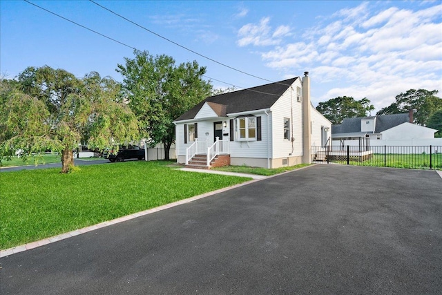 247 N Greene Ave, Lindenhurst, NY 11757 - view of front of property with a chimney and driveway
