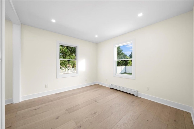 247 N Greene Ave, Lindenhurst, NY 11757 - empty room featuring baseboard heating, light wood-style floors, healthy amount of natural light, and recessed lighting
