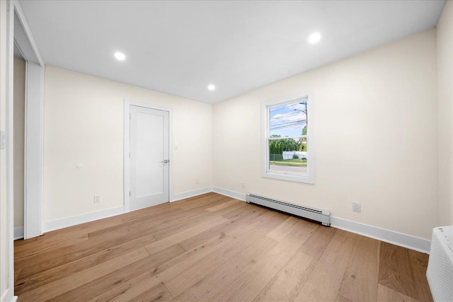 247 N Greene Ave, Lindenhurst, NY 11757 - spare room featuring a baseboard radiator, light wood-style floors, and recessed lighting