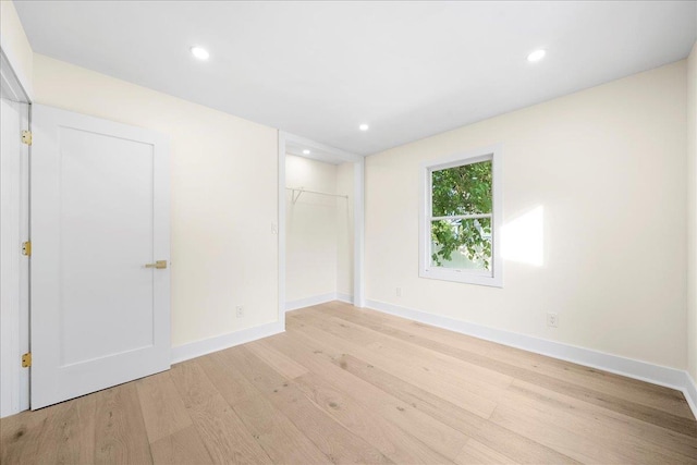 247 N Greene Ave, Lindenhurst, NY 11757 - unfurnished bedroom with light wood finished floors, recessed lighting, and a closet