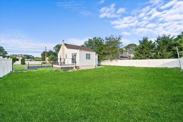 247 N Greene Ave, Lindenhurst, NY 11757 - fenced backyard featuring a wooden deck