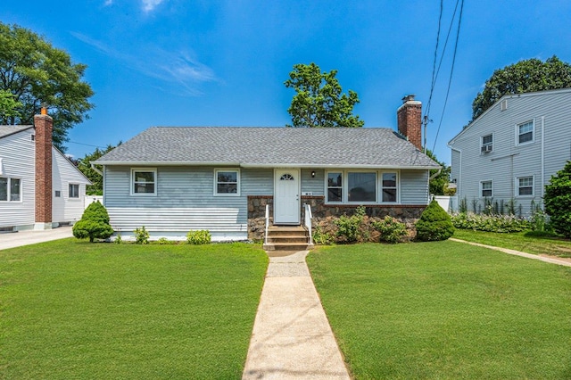 19 Dakota St, Hicksville, NY 11801 - bungalow-style house featuring a front lawn, a chimney, stone siding, and roof with shingles