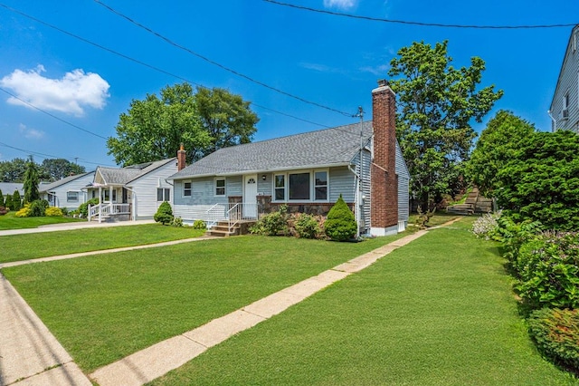 19 Dakota St, Hicksville, NY 11801 - view of front of house featuring a chimney and a front yard