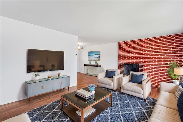 19 Dakota St, Hicksville, NY 11801 - living area featuring wood finished floors, a fireplace, and a chandelier