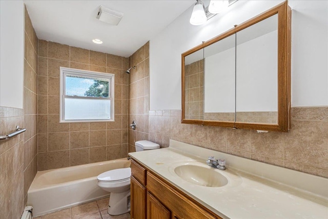 19 Dakota St, Hicksville, NY 11801 - bathroom featuring tile walls, vanity, tub / shower combination, baseboard heating, and tile patterned flooring