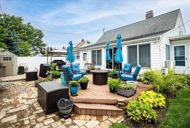 86 Shepherd Ln, Levittown, NY 11756 - wooden deck with outdoor lounge area, a shed, a patio, and a gazebo