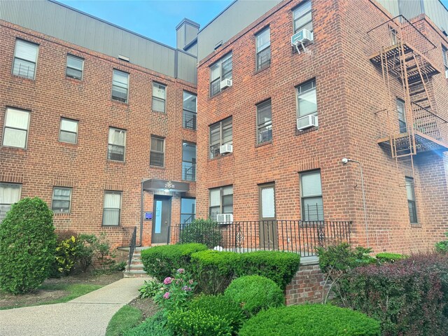 21511 48th Ave Unit 1B, Bayside, NY 11361 - view of apartment building / complex with cooling unit