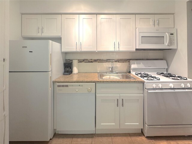21511 48th Ave Unit 1B, Bayside, NY 11361 - kitchen featuring white appliances, light countertops, decorative backsplash, light tile patterned flooring, and white cabinets