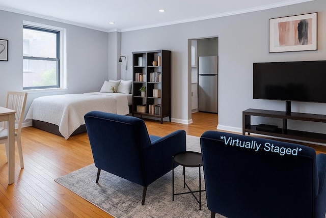 21511 48th Ave Unit 1B, Bayside, NY 11361 - bedroom featuring freestanding refrigerator, light wood-style flooring, ornamental molding, and recessed lighting