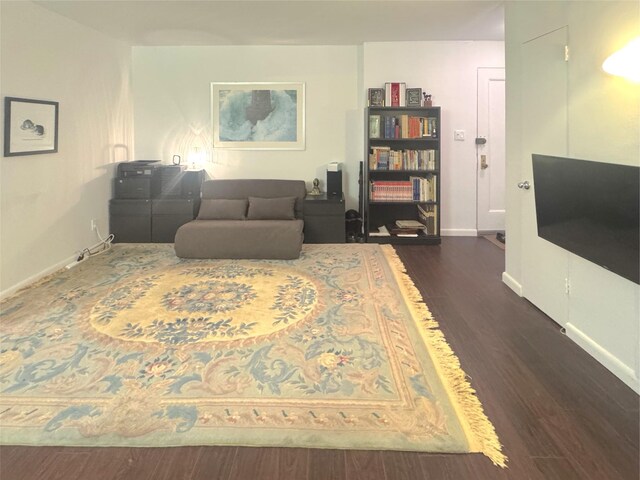 21511 48th Ave Unit 1B, Bayside, NY 11361 - living area featuring dark wood finished floors and baseboards