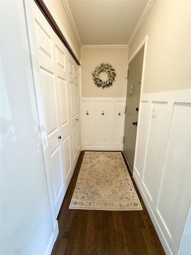 5 Church Ln Unit I, Valley Cottage, NY 10989 - hallway with a decorative wall, crown molding, a wainscoted wall, and dark wood-type flooring