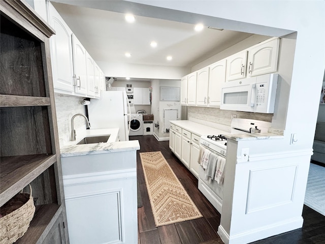 5 Church Ln Unit I, Valley Cottage, NY 10989 - kitchen with white appliances, dark wood finished floors, backsplash, white cabinets, and recessed lighting