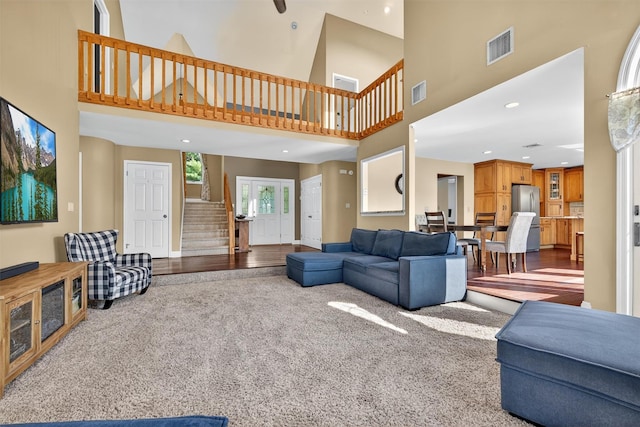 182 Otter Rd, Campbell Hall, NY 10916 - living area featuring stairway, a high ceiling, carpet flooring, and recessed lighting