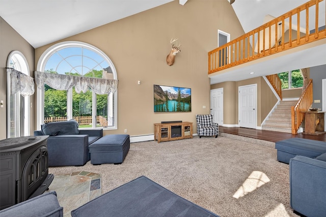 182 Otter Rd, Campbell Hall, NY 10916 - living area with high vaulted ceiling, stairs, a baseboard radiator, carpet, and plenty of natural light