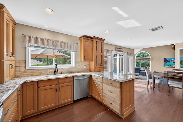 182 Otter Rd, Campbell Hall, NY 10916 - kitchen with stainless steel dishwasher, a peninsula, dark wood-style flooring, tasteful backsplash, and glass insert cabinets