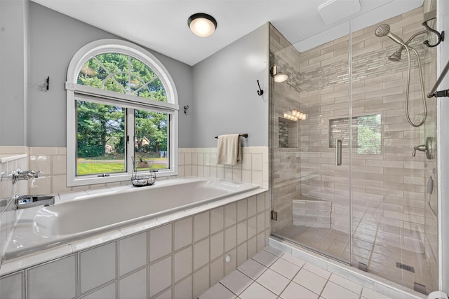 182 Otter Rd, Campbell Hall, NY 10916 - full bathroom with a garden tub, a shower stall, and tile patterned floors