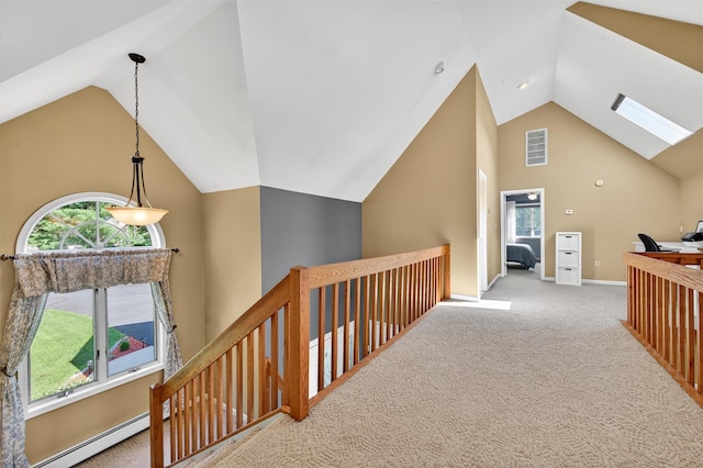 182 Otter Rd, Campbell Hall, NY 10916 - hallway with a baseboard heating unit, carpet flooring, high vaulted ceiling, an upstairs landing, and plenty of natural light