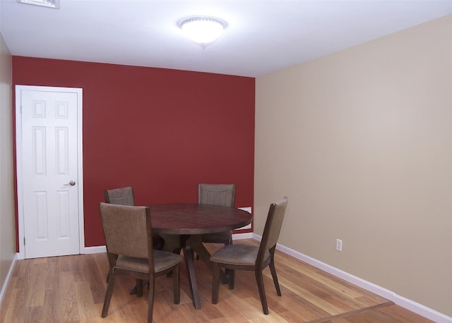 8 Country View Ln, Middle Island, NY 11953 - dining space with light wood-type flooring and baseboards