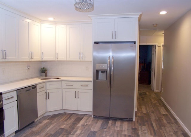 8 Country View Ln, Middle Island, NY 11953 - kitchen with appliances with stainless steel finishes, dark wood-style flooring, light countertops, tasteful backsplash, and white cabinetry