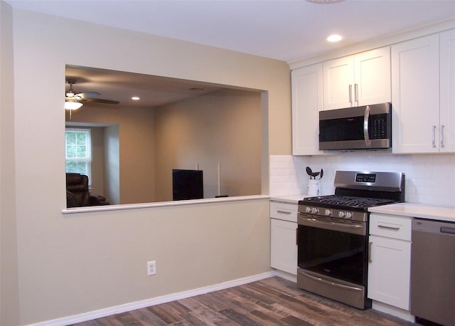 8 Country View Ln, Middle Island, NY 11953 - kitchen with appliances with stainless steel finishes, dark wood-type flooring, backsplash, white cabinets, and recessed lighting