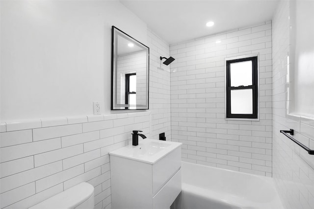 75-02 Springfield Blvd Fl 2Nd, Bayside, NY 11364 - full bathroom featuring vanity, tile walls, washtub / shower combination, and recessed lighting