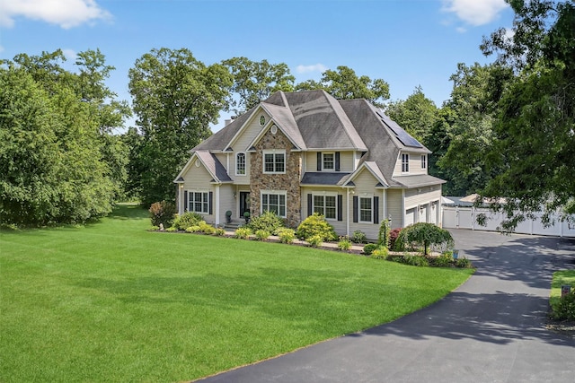 15 E Salem Rd, Fishkill, NY 12524 - view of front of house with stone siding, driveway, and an attached garage