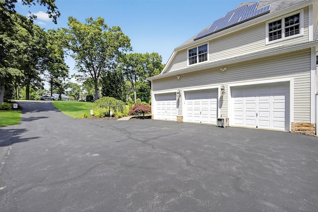 15 E Salem Rd, Fishkill, NY 12524 - garage featuring driveway and solar panels