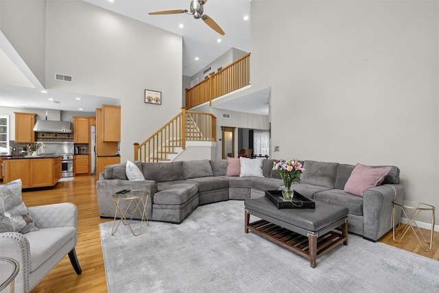 15 E Salem Rd, Fishkill, NY 12524 - living area featuring a high ceiling, ceiling fan, light wood-style flooring, stairway, and recessed lighting