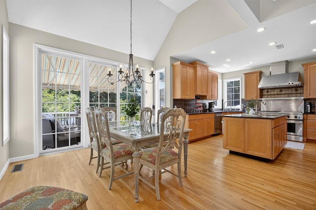15 E Salem Rd, Fishkill, NY 12524 - dining room with a chandelier, light wood-style floors, lofted ceiling, and recessed lighting