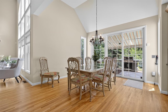 15 E Salem Rd, Fishkill, NY 12524 - dining space featuring high vaulted ceiling, light wood finished floors, and a chandelier