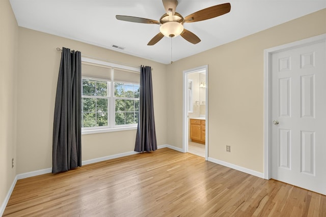 15 E Salem Rd, Fishkill, NY 12524 - unfurnished bedroom with light wood-style flooring, ceiling fan, and connected bathroom