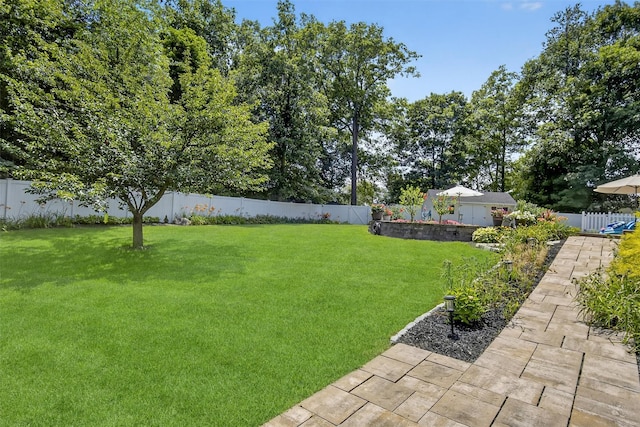15 E Salem Rd, Fishkill, NY 12524 - fenced backyard with a patio area