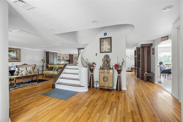 10 Faulkner Ln, Dix Hills, NY 11746 - entryway featuring arched walkways and light wood-style flooring
