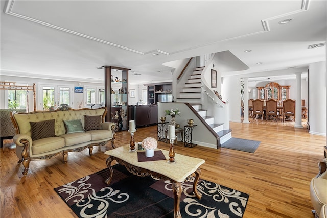 10 Faulkner Ln, Dix Hills, NY 11746 - living area with stairway, wood finished floors, recessed lighting, and decorative columns