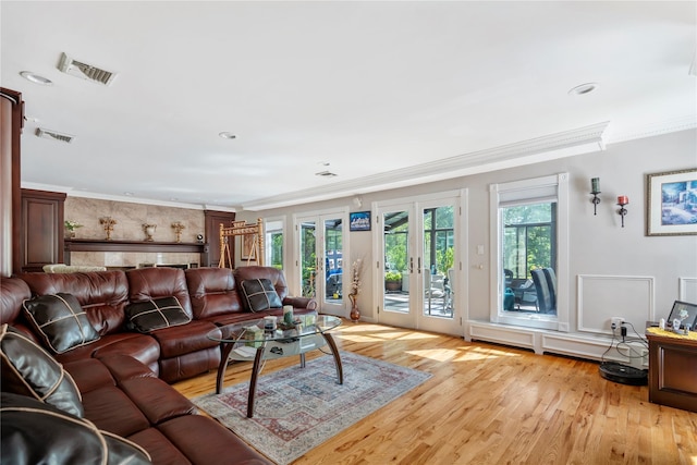10 Faulkner Ln, Dix Hills, NY 11746 - living room featuring crown molding, french doors, light wood-type flooring, and recessed lighting