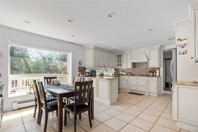 10 Faulkner Ln, Dix Hills, NY 11746 - dining area with a baseboard heating unit, light tile patterned floors, and recessed lighting