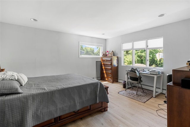 10 Faulkner Ln, Dix Hills, NY 11746 - bedroom with light wood finished floors, baseboard heating, a desk, and recessed lighting