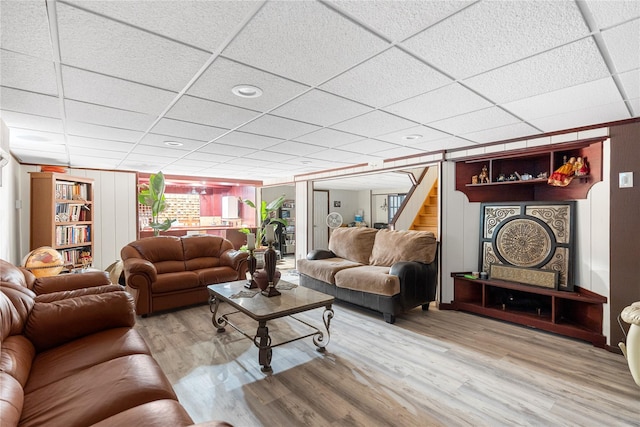 10 Faulkner Ln, Dix Hills, NY 11746 - living area featuring a drop ceiling, wood finished floors, and stairs