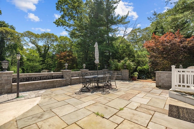 10 Faulkner Ln, Dix Hills, NY 11746 - view of patio / terrace with outdoor dining space and view of wooded area