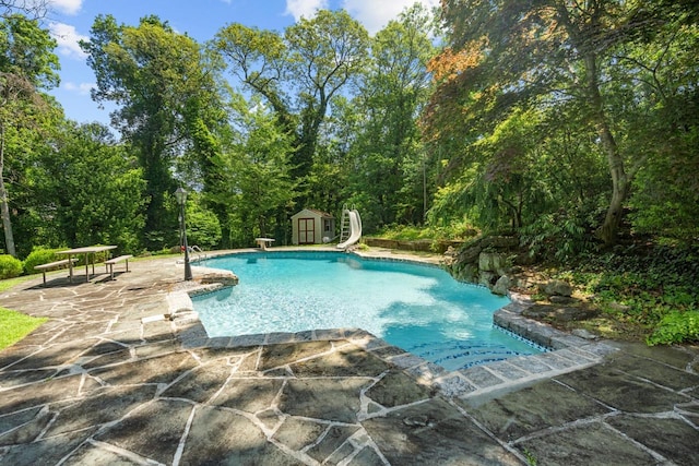 10 Faulkner Ln, Dix Hills, NY 11746 - outdoor pool featuring a water slide, a patio, a shed, and a diving board
